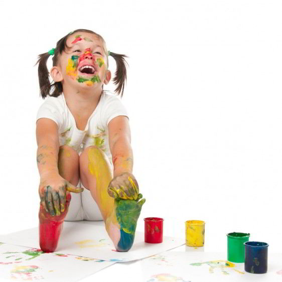 Happy child painting