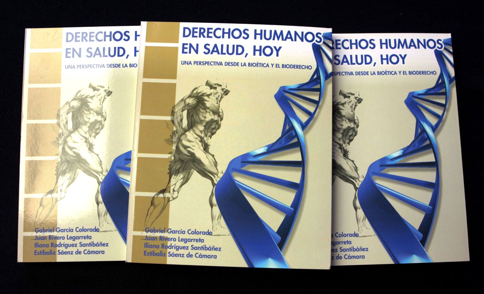 Portada muestra una ilustración de los musculos de un cuerpo humano y una cadena de ADN con el título “Derechos Humanos en Salud, Hoy. Una perspectiva desde la Bioética y el Bioderecho”