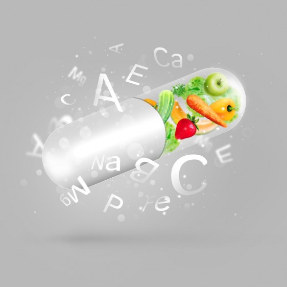 Ilustración de capsula con frutas y vitaminas